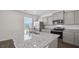 Bright kitchen featuring stainless steel appliances, granite countertops, and modern cabinets at 8593 Secretariat Drive, Lithonia, GA 30058
