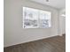 Bright living room showcasing new hardwood floors and light-filled rooms with large window at 8593 Secretariat Drive, Lithonia, GA 30058