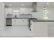 Bright kitchen with white cabinets, stainless steel appliances and a black counter at 1956 Washington Rd, Atlanta, GA 30344