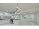 Modern kitchen with white cabinets, black countertops, and stainless steel appliances at 1956 Washington Rd, Atlanta, GA 30344
