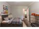Cozy bedroom with industrial style bed and decor, with neutral tones at 20 Rosebud Ln, Mcdonough, GA 30253