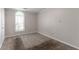 A carpeted bedroom with a neutral wall color, window, and trim at 20 Rosebud Ln, Mcdonough, GA 30253