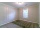 Neutral bedroom with large window and carpet flooring, great natural light at 20 Rosebud Ln, Mcdonough, GA 30253