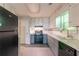 A kitchen with gray cabinets, tile backsplash, and stainless steel appliances at 20 Rosebud Ln, Mcdonough, GA 30253