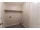 Empty laundry room featuring tile floor, neutral walls, and great layout at 20 Rosebud Ln, Mcdonough, GA 30253