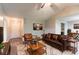 Cozy living room featuring stylish leather furniture, a ceiling fan, and wood floors with an area rug at 20 Rosebud Ln, Mcdonough, GA 30253