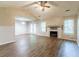 Spacious living room features hardwood floors, a fireplace, and French doors to the outside at 20 Rosebud Ln, Mcdonough, GA 30253