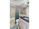 Bathroom with granite vanity, modern fixtures, and large bathtub with shower at 2575 Peachtree Ne Rd # 15G, Atlanta, GA 30305