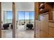Bright bedroom features large windows with scenic views and custom closet with built-ins at 2575 Peachtree Ne Rd # 15G, Atlanta, GA 30305