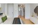 Bright bedroom with wood floors leads to ensuite bathroom and spacious closet at 2575 Peachtree Ne Rd # 15G, Atlanta, GA 30305