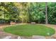 Well maintained dog park with lush green grass, mature trees and benches for residents to enjoy at 2575 Peachtree Ne Rd # 15G, Atlanta, GA 30305