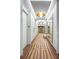 Elegant hallway features stylish lighting, mirrors, and a patterned carpet at 2575 Peachtree Ne Rd # 15G, Atlanta, GA 30305
