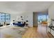 Comfortable living room with a blue couch and a view at 2575 Peachtree Ne Rd # 15G, Atlanta, GA 30305