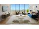 Bright living room with floor-to-ceiling windows and contemporary furnishings at 2575 Peachtree Ne Rd # 15G, Atlanta, GA 30305