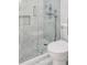Modern shower with sleek glass door, marble tile surround and rainfall showerhead at 2575 Peachtree Ne Rd # 15G, Atlanta, GA 30305
