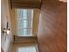 Bright bedroom with three windows with blinds, a ceiling fan, and hardwood floors at 1629 Marsanne Ter, Kennesaw, GA 30152