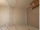 Spacious walk-in closet with white shelving, ready for organization and storage solutions at 1629 Marsanne Ter, Kennesaw, GA 30152