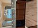 Elegant kitchen with granite countertops, stainless steel sink, and dark wood cabinetry at 1629 Marsanne Ter, Kennesaw, GA 30152