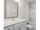 Neutral toned bathroom with white vanity and full shower/bath at 3382 Monarch Ave, Duluth, GA 30096