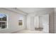 Neutral-toned bedroom with two windows providing natural light and privacy at 3382 Monarch Ave, Duluth, GA 30096