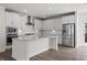 Bright kitchen with white cabinets, stainless steel appliances, and a large center island perfect for entertaining at 3382 Monarch Ave, Duluth, GA 30096