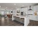 Bright, open kitchen with granite countertops, stainless steel appliances, and island seating at 3382 Monarch Ave, Duluth, GA 30096