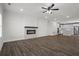 Open floor plan showcasing a modern fireplace and a well-equipped kitchen with stainless steel appliances at 3382 Monarch Ave, Duluth, GA 30096
