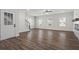Spacious living room featuring hardwood floors, natural light, and a staircase leading to the second floor at 3382 Monarch Ave, Duluth, GA 30096