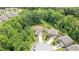 Aerial view of a lovely home nestled among lush trees in a quiet neighborhood at 3392 Fall Branch Ln, Buford, GA 30519