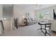 Spacious bonus room with plush carpet, a comfortable couch, and a window with natural light at 3392 Fall Branch Ln, Buford, GA 30519