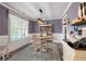 Charming dining room with stylish decor and a large window offering natural light at 3392 Fall Branch Ln, Buford, GA 30519