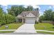 Lovely home with a manicured lawn and an attached garage, providing a welcoming curb appeal at 3392 Fall Branch Ln, Buford, GA 30519