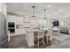 Well-lit kitchen featuring granite countertops, stainless steel appliances, and modern cabinetry at 3392 Fall Branch Ln, Buford, GA 30519