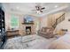 Cozy living room featuring a stone fireplace, recessed lighting, and comfortable seating arrangements at 3392 Fall Branch Ln, Buford, GA 30519