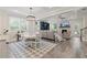 Inviting living space with fireplace, built-in shelves, and adjacent kitchen and dining areas at 3392 Fall Branch Ln, Buford, GA 30519