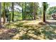 Spacious backyard with mature trees, offering shade and a serene atmosphere at 3122 Vandiver Dr, Marietta, GA 30066