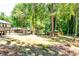 Expansive yard featuring mature trees, the deck, and a secondary outdoor covered patio at 3122 Vandiver Dr, Marietta, GA 30066