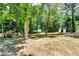 Lush backyard featuring mature trees offering plenty of shade and privacy at 3122 Vandiver Dr, Marietta, GA 30066