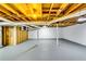 Unfinished basement shows white painted walls, support beams, utility connections, and gray painted floors at 3122 Vandiver Dr, Marietta, GA 30066