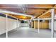 Unfinished basement features white painted walls, support beams, utility connections, and gray painted floors at 3122 Vandiver Dr, Marietta, GA 30066