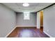 Unfinished basement offers wood-look flooring, painted walls, drop ceiling and a small window at 3122 Vandiver Dr, Marietta, GA 30066