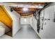 Unfinished basement shows painted walls, exposed ceiling, utility connections, and gray painted floors at 3122 Vandiver Dr, Marietta, GA 30066