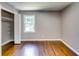 Bedroom features hardwood flooring, a closet, freshly painted walls and a sunny window at 3122 Vandiver Dr, Marietta, GA 30066