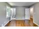 Bedroom features hardwood flooring, freshly painted walls, two closets, and window views at 3122 Vandiver Dr, Marietta, GA 30066