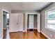 Bedroom featuring gleaming hardwood floors, double door closets and natural light from the exterior at 3122 Vandiver Dr, Marietta, GA 30066