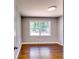 Bedroom featuring gleaming hardwood floors and natural light from the window at 3122 Vandiver Dr, Marietta, GA 30066
