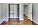 Bedroom featuring gleaming hardwood floors and a closet with open doors at 3122 Vandiver Dr, Marietta, GA 30066