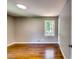 Bedroom featuring gleaming hardwood floors and natural light from a window at 3122 Vandiver Dr, Marietta, GA 30066