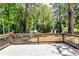 View from a spacious deck overlooking a lush, green backyard with mature trees at 3122 Vandiver Dr, Marietta, GA 30066