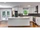 Modern kitchen featuring stainless steel appliances, quartz countertops and a backsplash at 3122 Vandiver Dr, Marietta, GA 30066